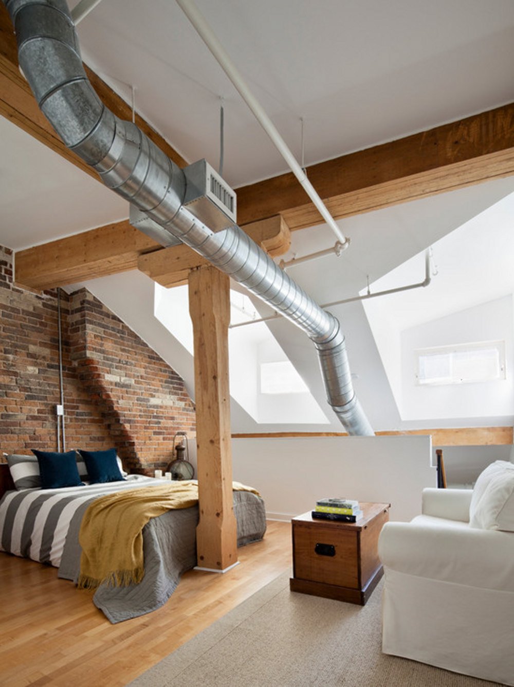 industrial-bedroom-interior-design-ideas-with-wooden-floors-and-white-sofa-chair
