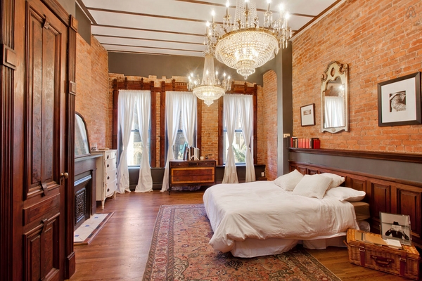 luxury-bedroom-ideas-large-chandeliers-brick-walls