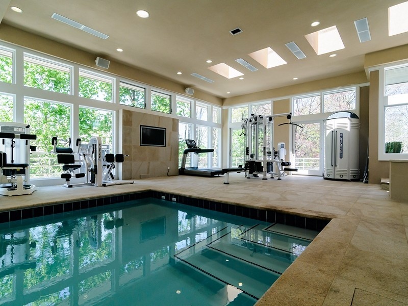 modern-home-gym-with-sunroom-and-entertainment-center