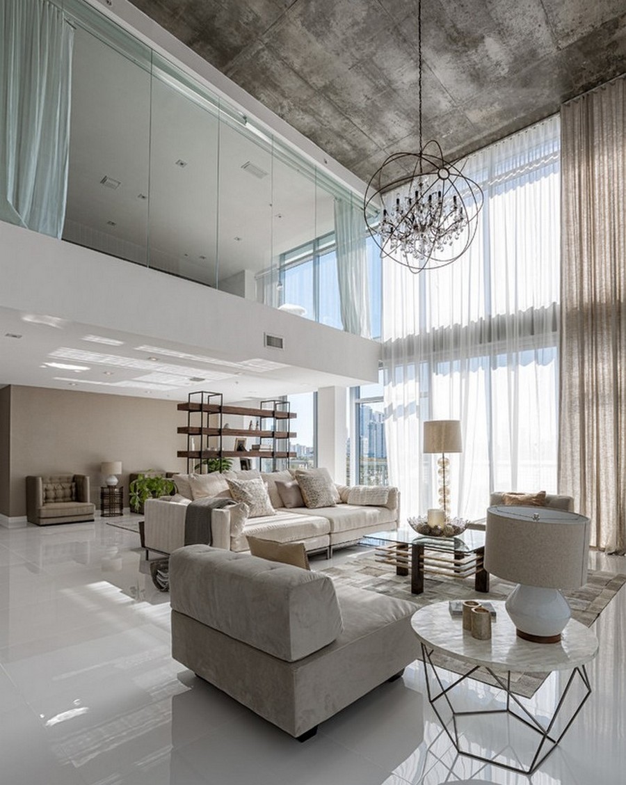 open-living-room-coupled-with-loft-featuring-floor-to-ceiling-window-with-transparent-curtain-and-hanging-crystal-chandelier