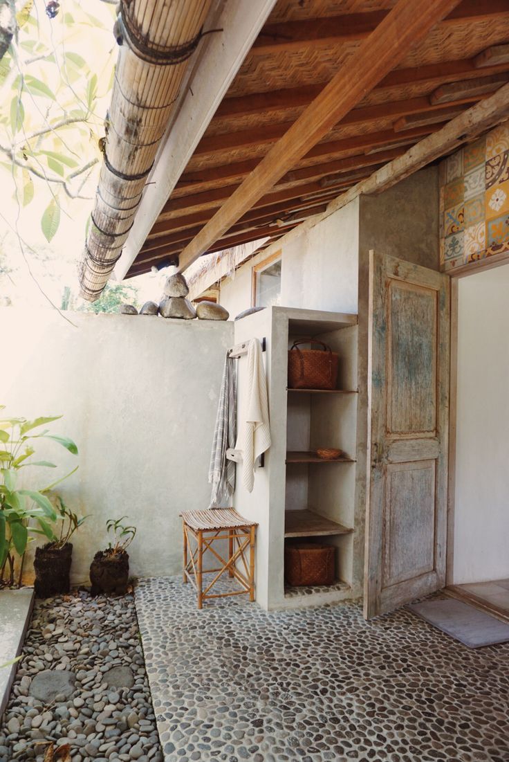 pebbles and tiles in this magical outdoor bathroom