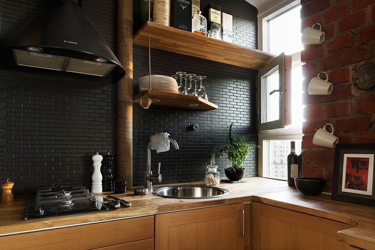 Black-subway-tile-backsplash-in-a-modern-kitchen