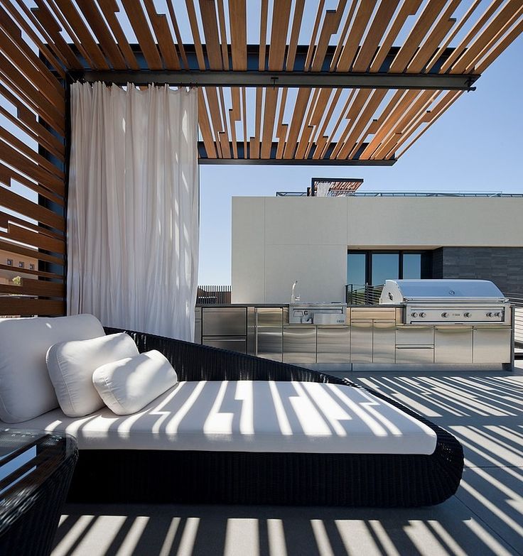 Contemporary steel and timber cantilevered pergola