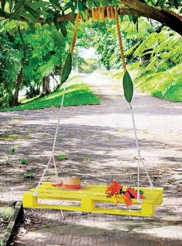 DIY yellow swing pallet bed