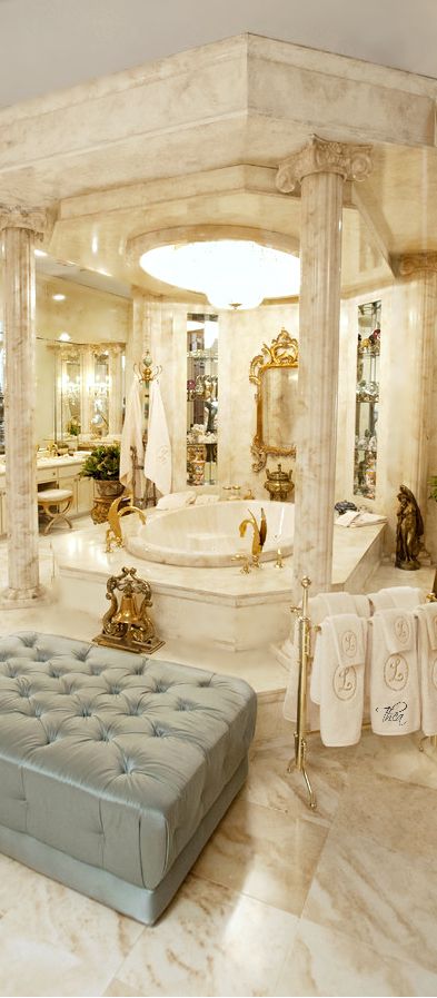Luxurious arabic style bathroom included golden accessories, leather couch with marble finifshing