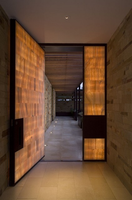 Contemporary entry door made with wood and glass pane