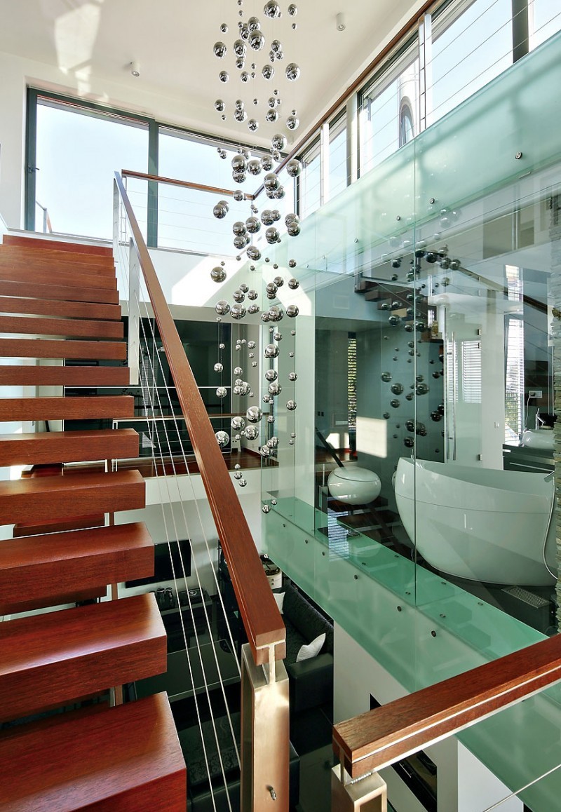 modern wooden staircase with transparent bathroom