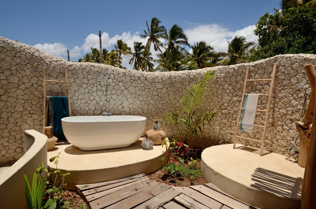 open air white sands outdoor shower and bathtub