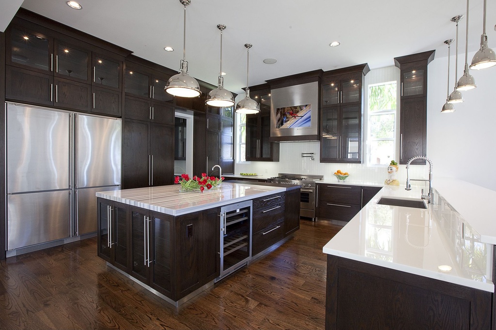Contemporary dark wood flooring and island in kitchen