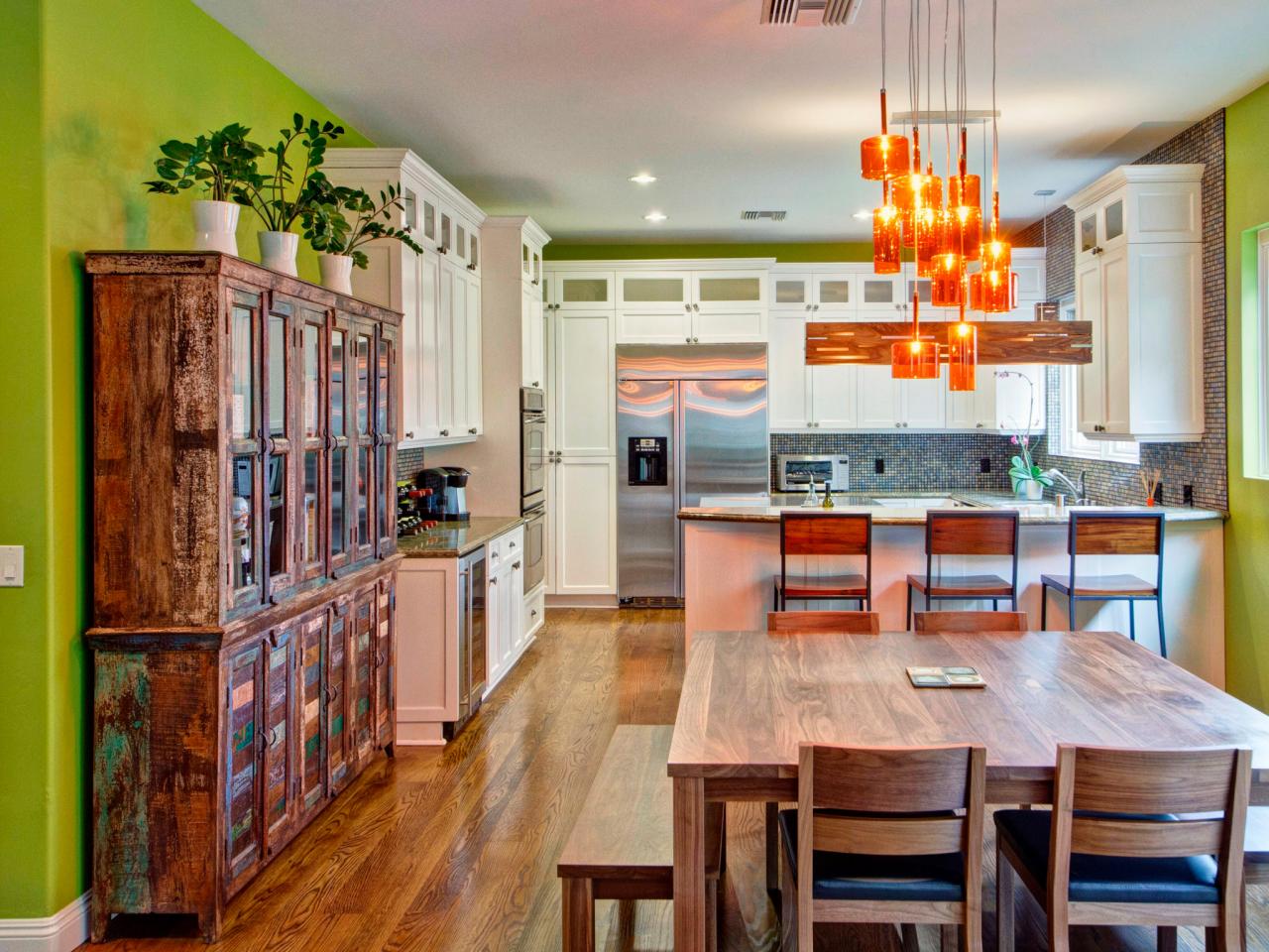 Green Eclectic Kitchen With Orange Pendant Lamps