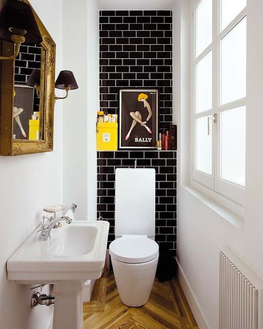 Tiny Modern bathroom with black Subway Tile and white grout