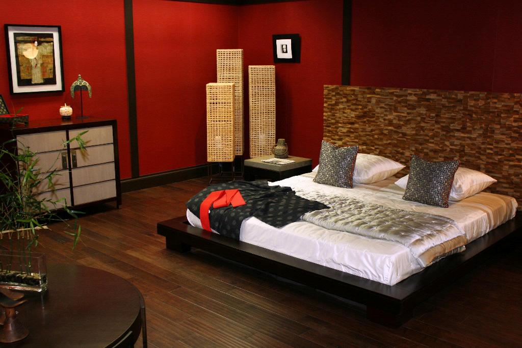 master-bedroom-design-with-beautiful-wood-laminating-floor-and-red-wall