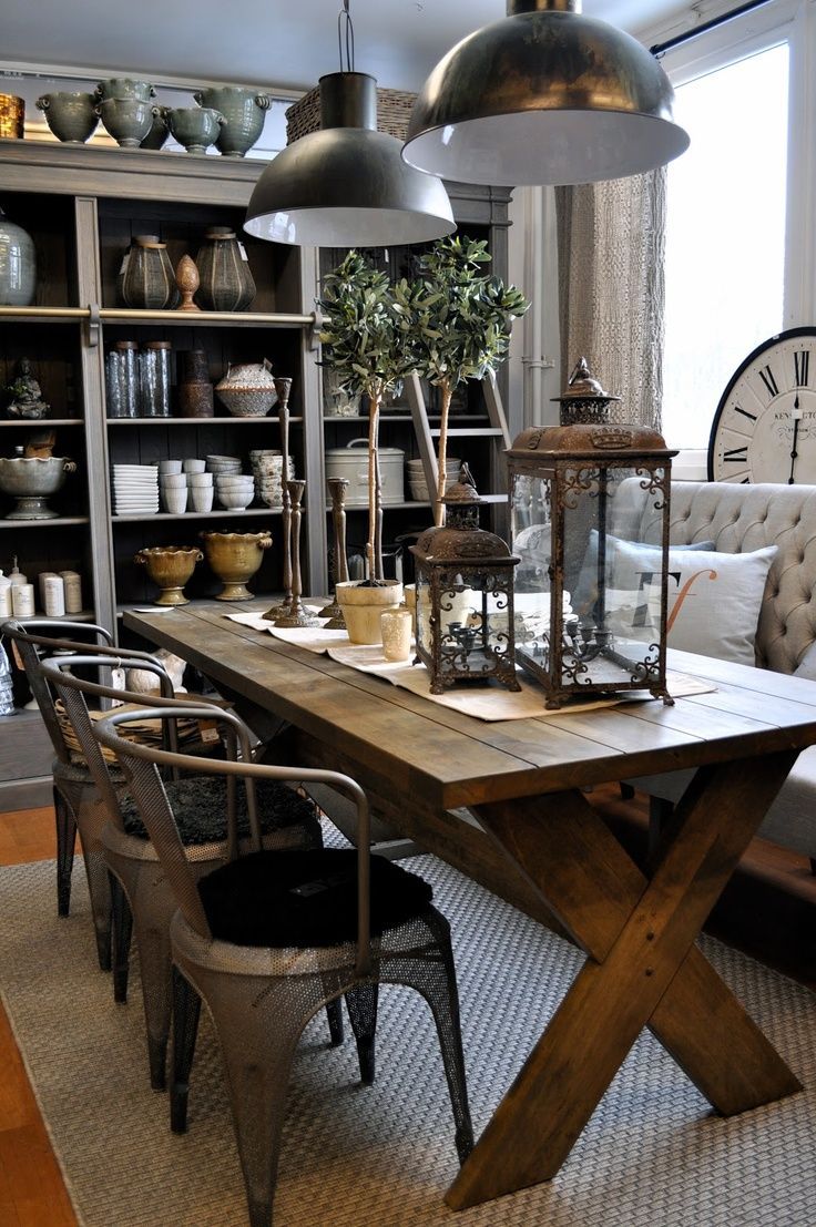 Loving this dining room. The rustic table, metal chairs, and upholstered bench