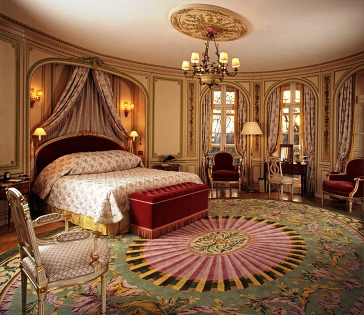 Mediterranean Master Bedroom with Hardwood floors
