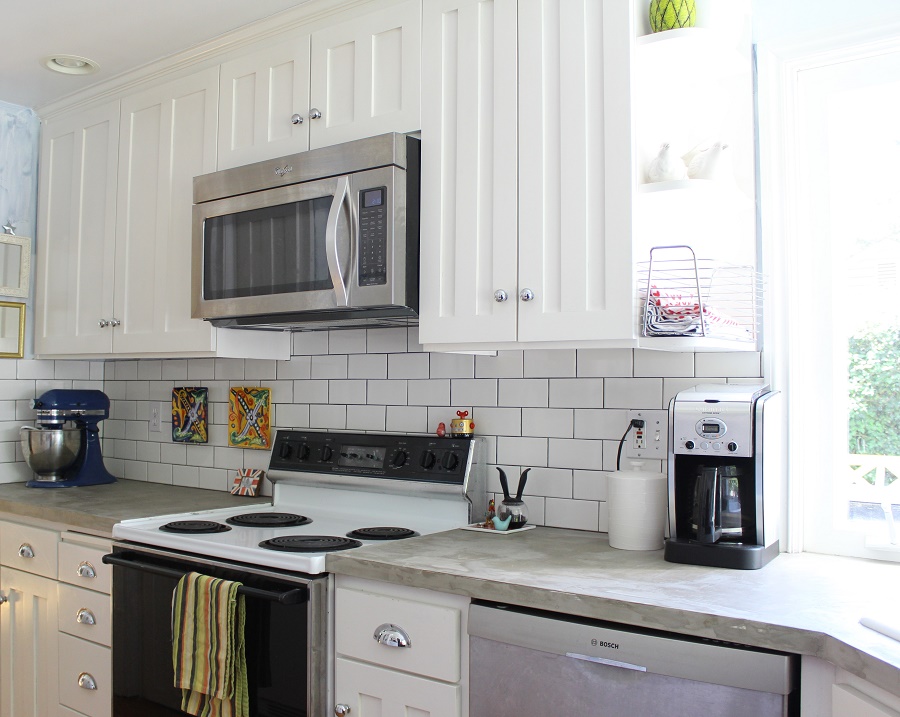 White Wooden Cabinets With Subway Wall