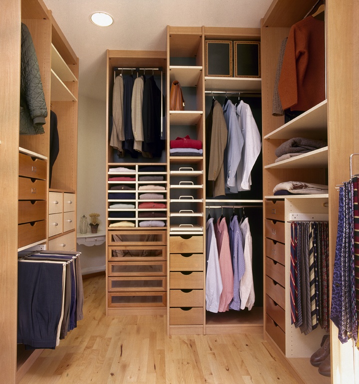 Eclectic Closet with Laminate wood shelving