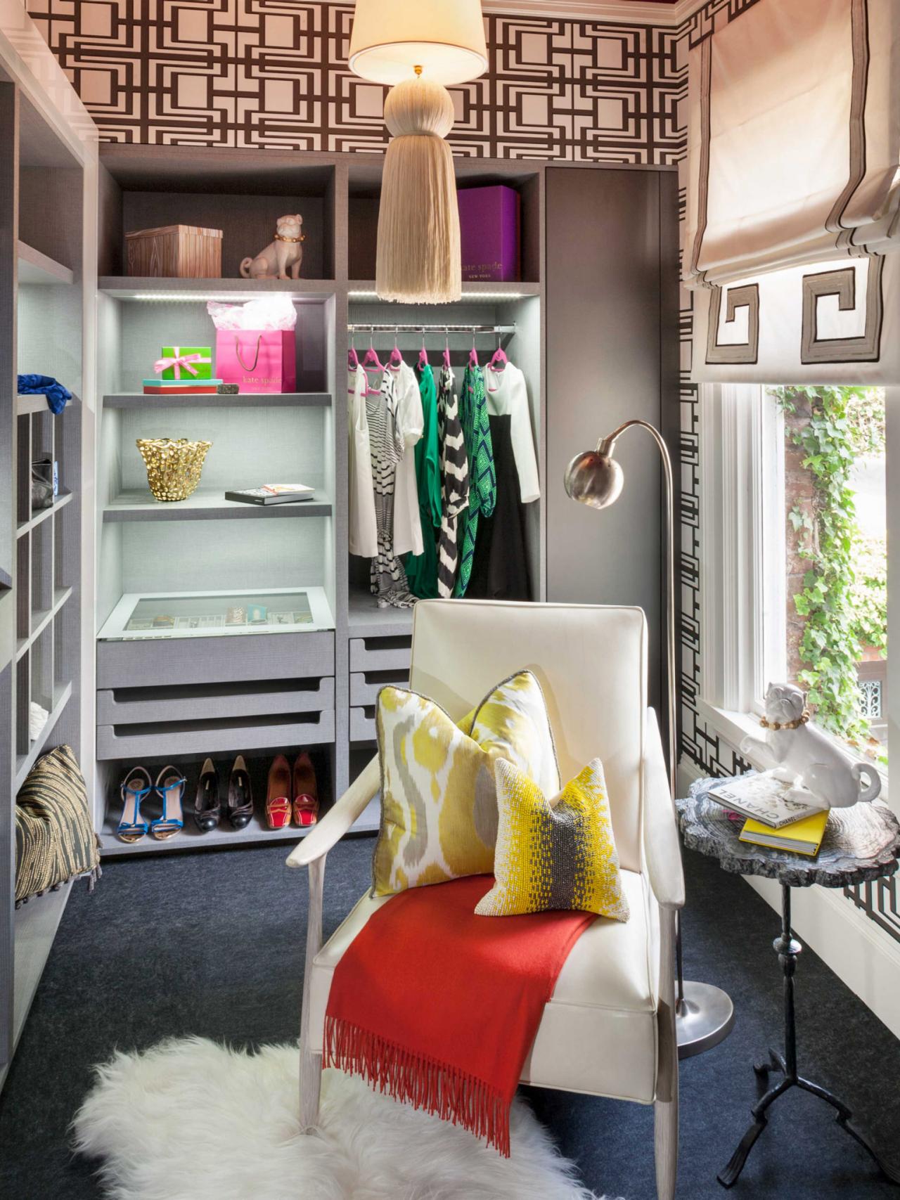 Eclectic Walk-In Closet With White Modern Armchair