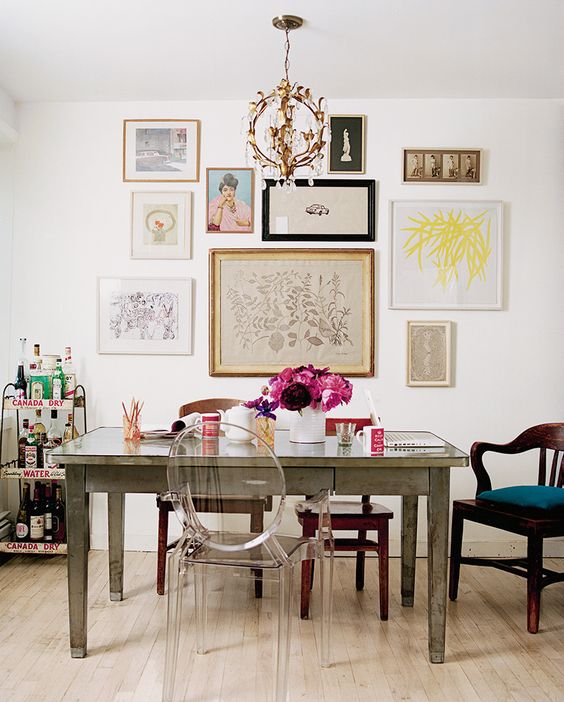 Eclectic dining room featuring a lovely gallery wall