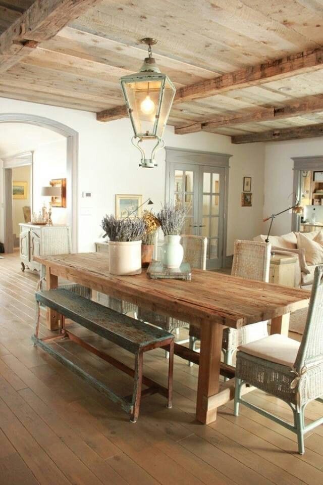 rustic dining room with farmhouse table and eclectic chair set