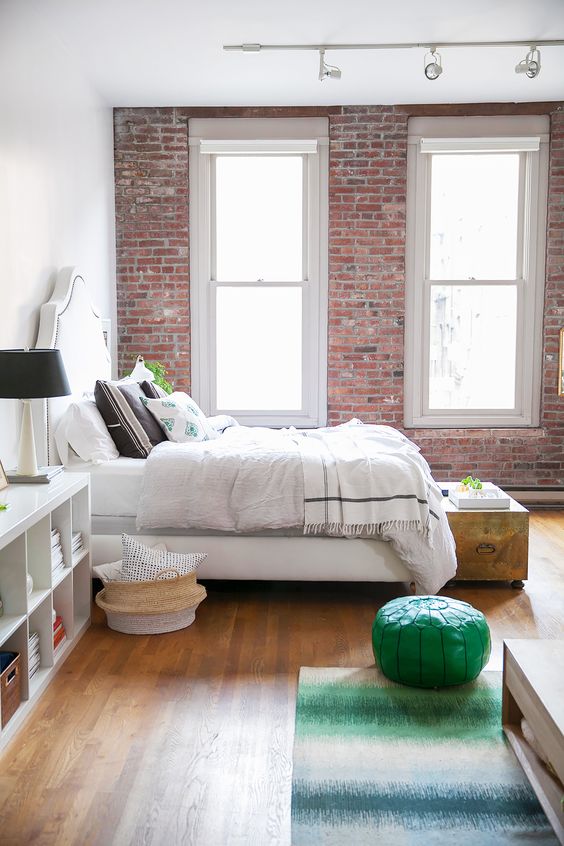 bright-bedroom-with-exposed-brick-walls