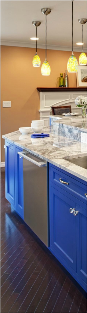 Kitchen With Marble Countertops and Bright Blue Island