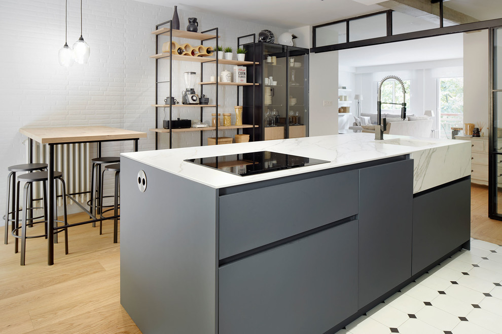 Scandinavian Galley Kitchen With gray cabinets and an island dwellingdecor
