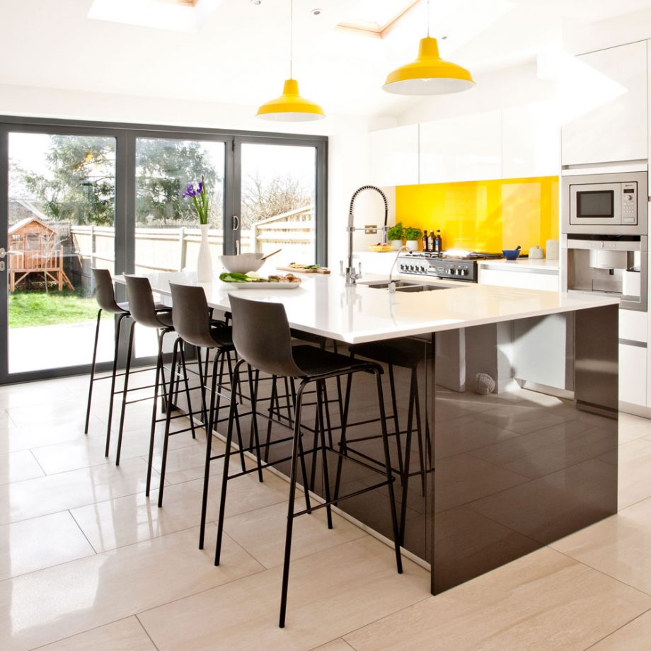Modern Kitchen With sleek and glossy Island Dwellingdecor
