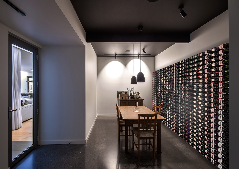 Beautiful Modern Wine Cellar With Black Pendant Lights