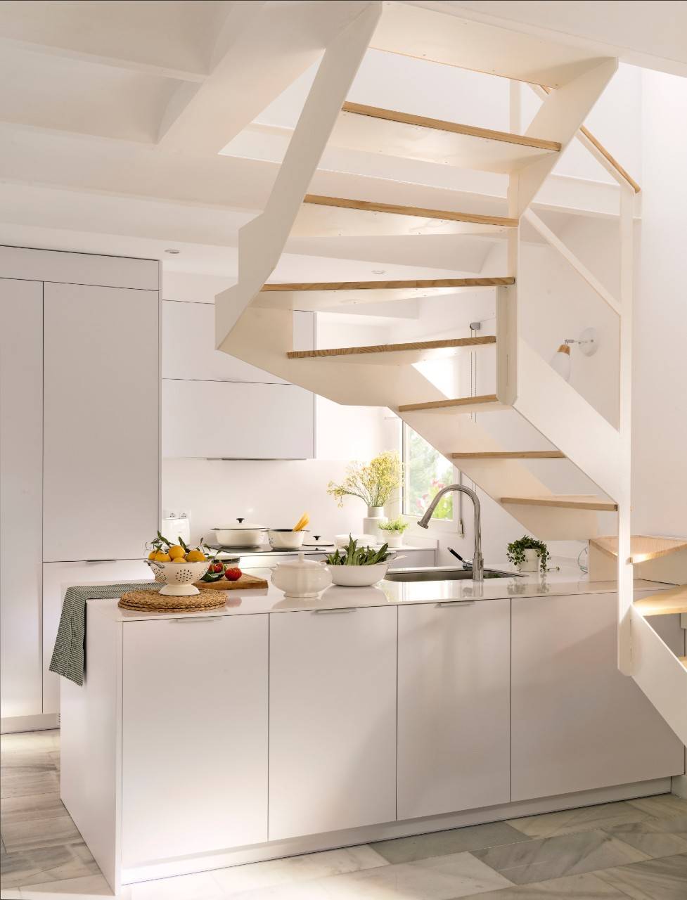 A MINI KITCHEN UNDER THE STAIRS