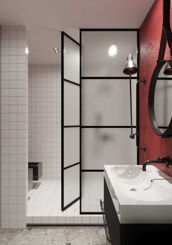 06. Modern decorated bathroom with glass shower and red wall.