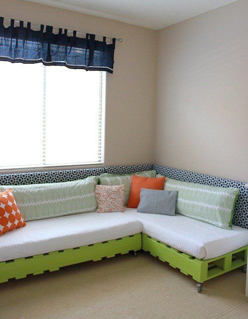 09. Pallet corner sofa with green paint and colorful pillows