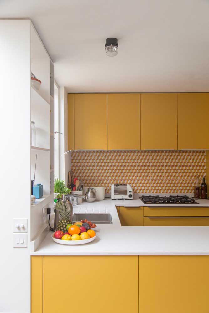 11. A charm in this small American kitchen with yellow and white furniture.