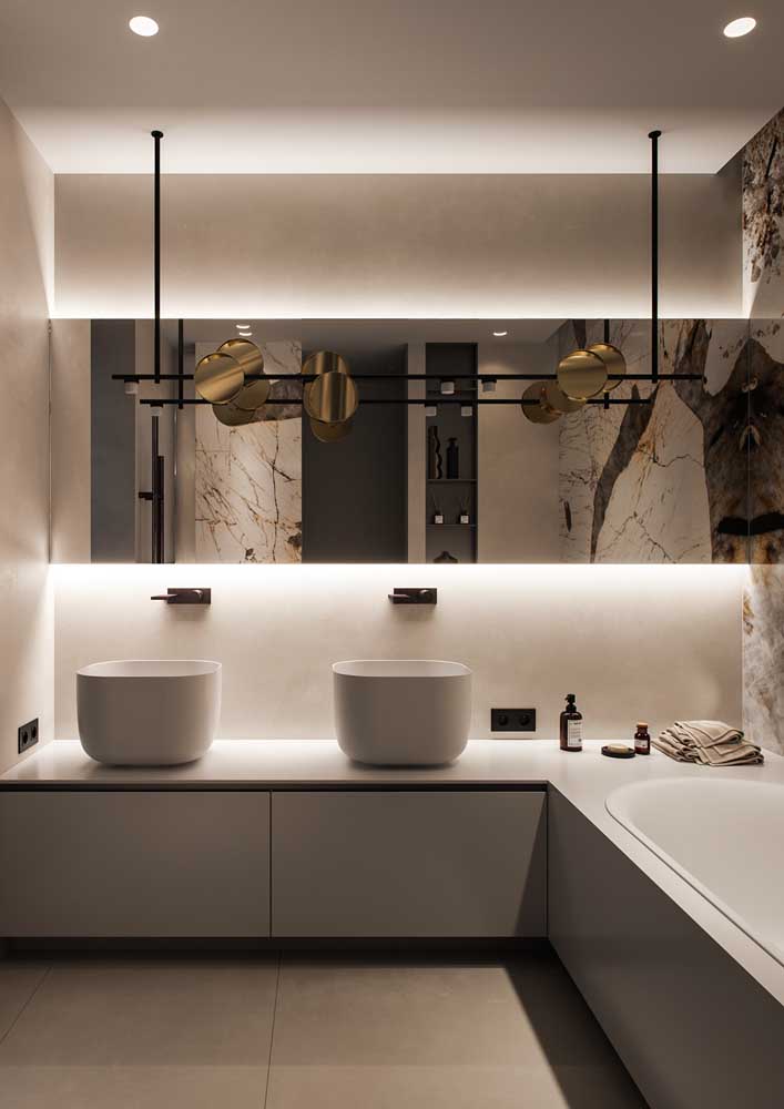11. Mirrors and lighting tailored to enhance the decorated bathroom.