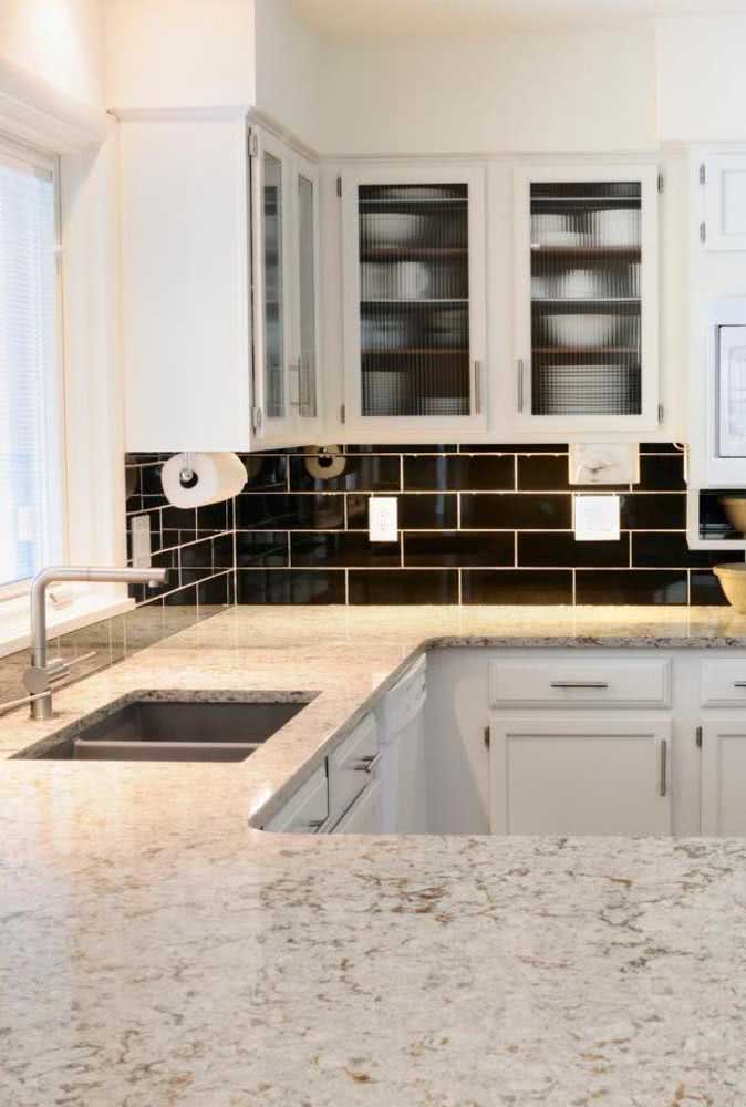 17 - Kitchen in black and white has what? A white granite countertop of course!