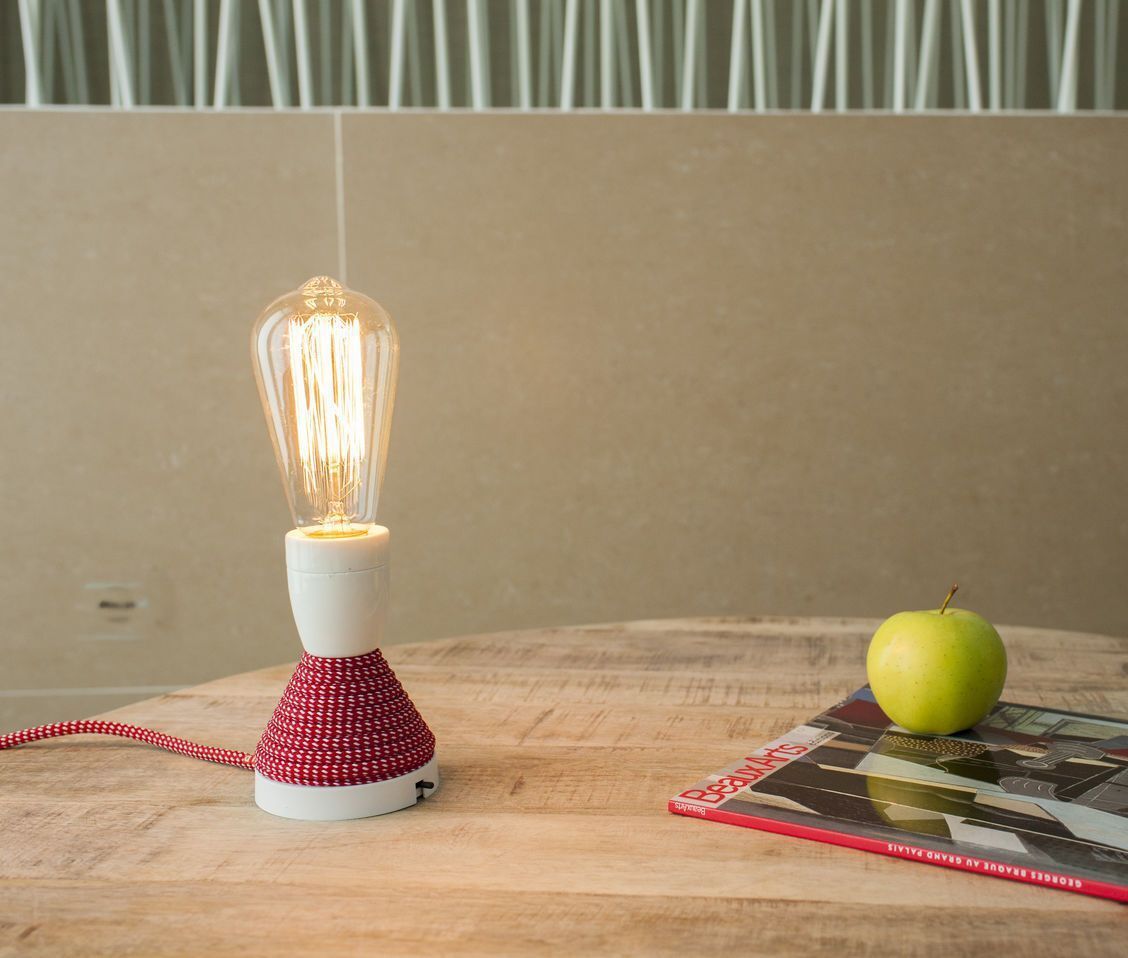 29 -Unusual, a bulb lamp signed Gross Domestic Product