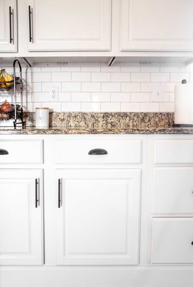 39 - The white kitchen gained color with the yellow granite countertop.