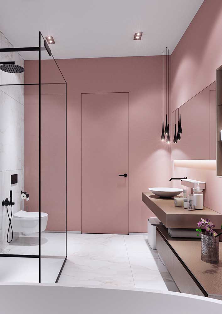 39. For the pink bathroom to be more modern, add black details.