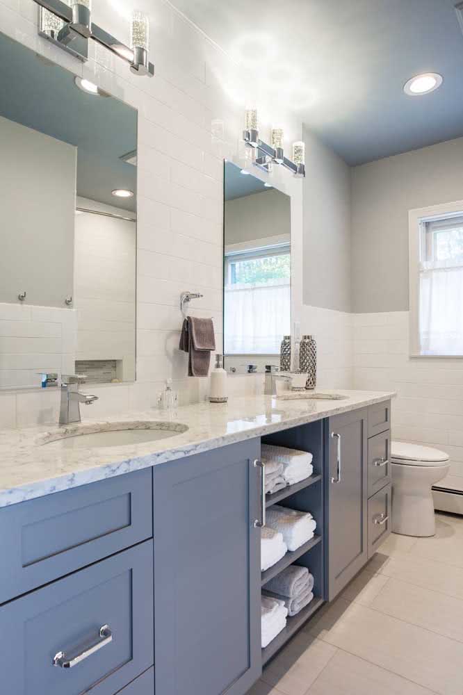 43 - White granite with blue cabinets.