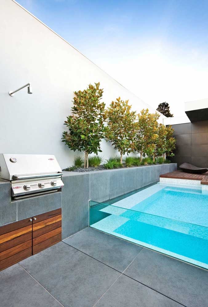 08. Leisure area with small and simple barbecue. The glass edge pool is the highlight of this project.