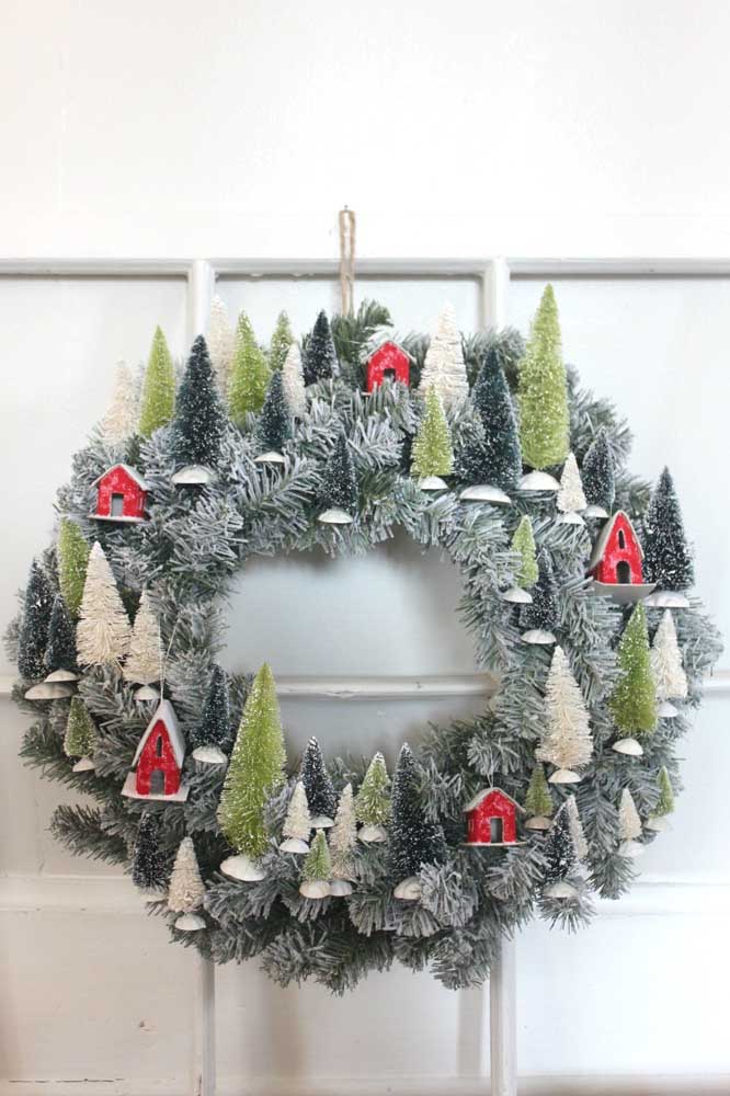 A Mini-city Covered in Snow is Depicted on the Wreath