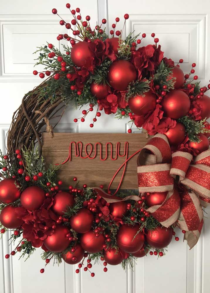 Wreath With Typical Christmas Red on the Base of Tree Branches