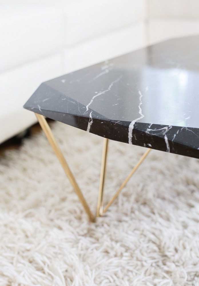 38. The charm of a coffee table with a nero marble top and gilded feet.